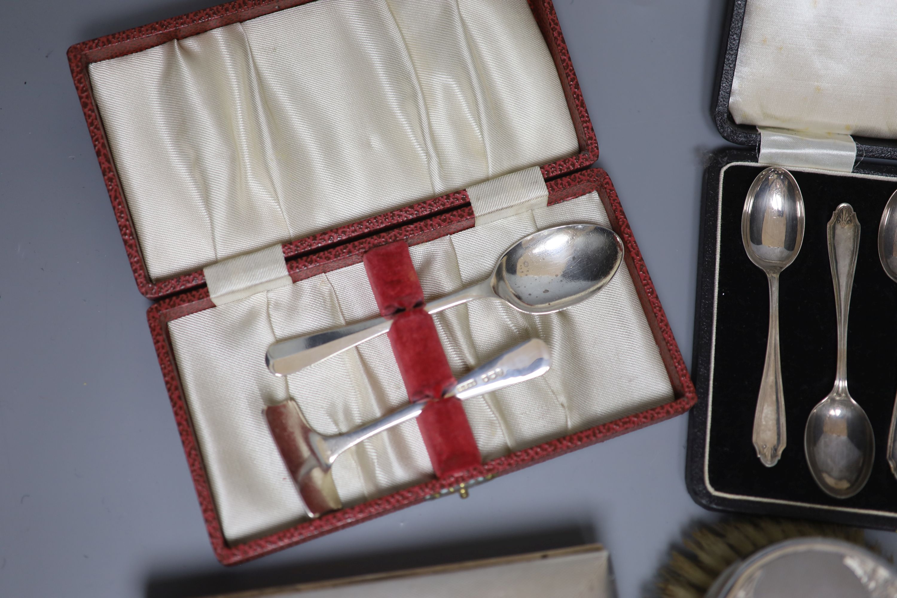 A silver cigarette case, brush set, cased spoons etc and a late Victorian miniature silver settee, Sheffield, 1897.